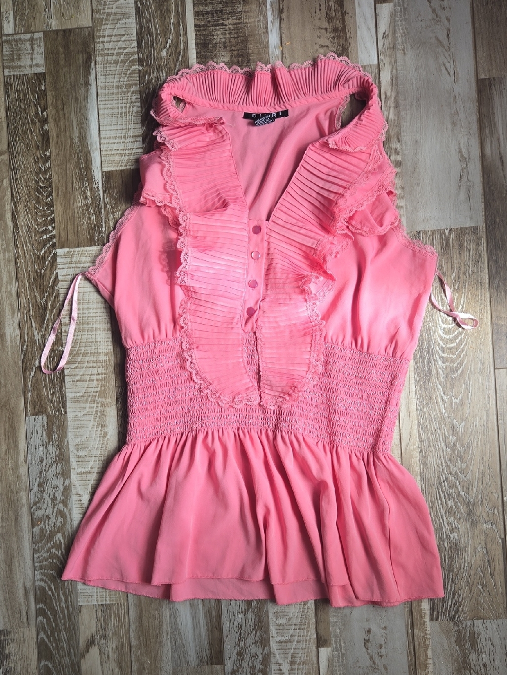 Sleeveless Pink Ruffle-Trim Peplum Blouse